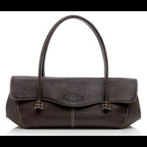 Tod’s Corniche Wave clutch in chocolate brown